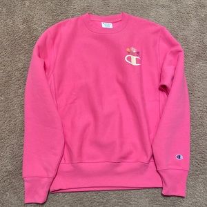 Hot pink Champion sweater. The size is medium, and it is in very good condition.